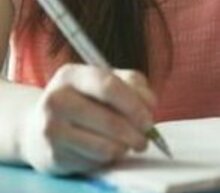 Event grid female student writing notes in binder in college library 175138304 58e638755f9b58ef7e7a2a5b